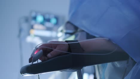 a medical professional wearing blue gloves administers an injection to a patient in a clinical setting. the focus is on the arm and syringe, highlighting the sterile environment and precision required in medical procedures.