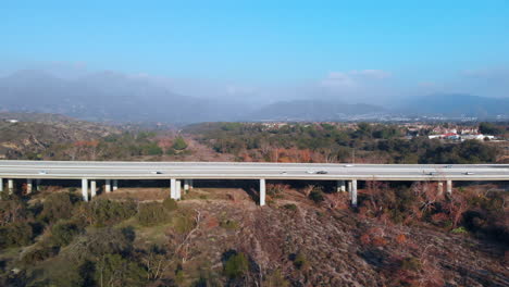 aerial fly into bridge close up with a mountain background