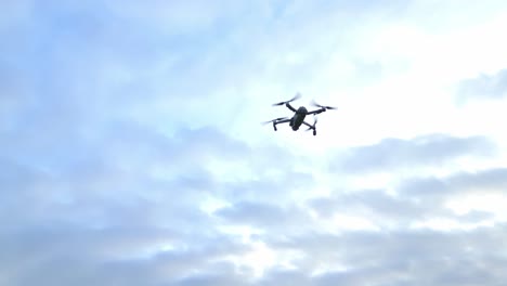 Drone-Camera-Flying-Over-Green-Meadows-With-Dramatic-Sunset-Sky