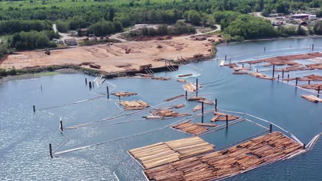 log loading action: aerial view of campbell river station, vancouver island