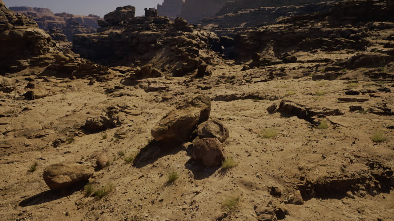 A vast desert terrain showcases rugged rock formations and scattered boulders