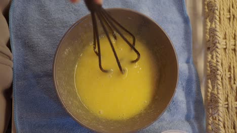 mixing eggs and milk for baking