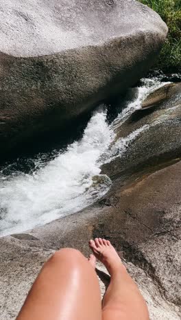 relaxing by a waterfall