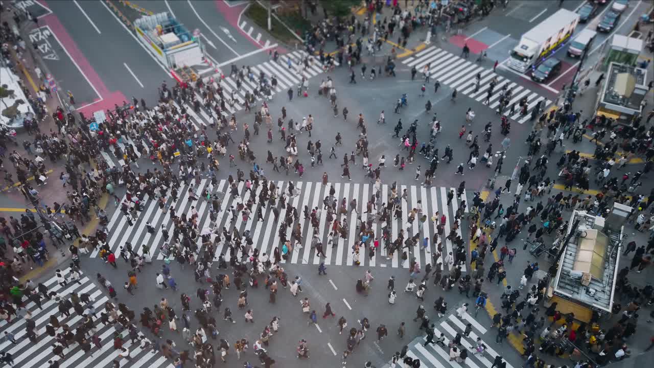 POV of many people walking crossing road in shibuya street area in daytime before covid19 outbreak in slowmotion