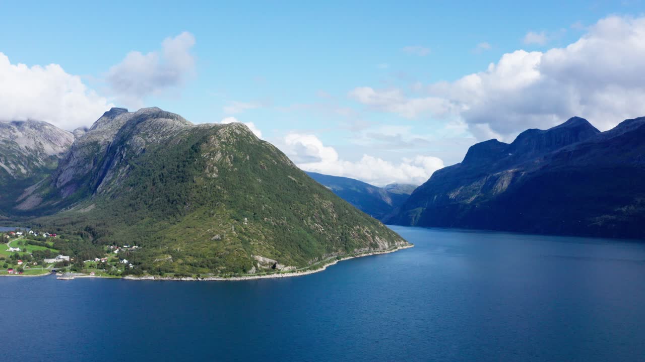 Beautiful blue water by the Helgelandskysten mountains in Norway -Aerial
