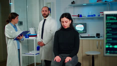 team of scientists specializing in neurological medicine discussing