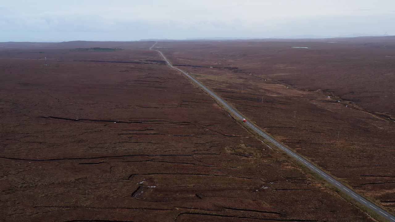 Drone shot of moorland peat banks near a road between Stornoway and Barvas