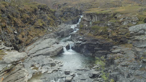 Stream-of-water-flows-thru-rocks-in-slow-motion