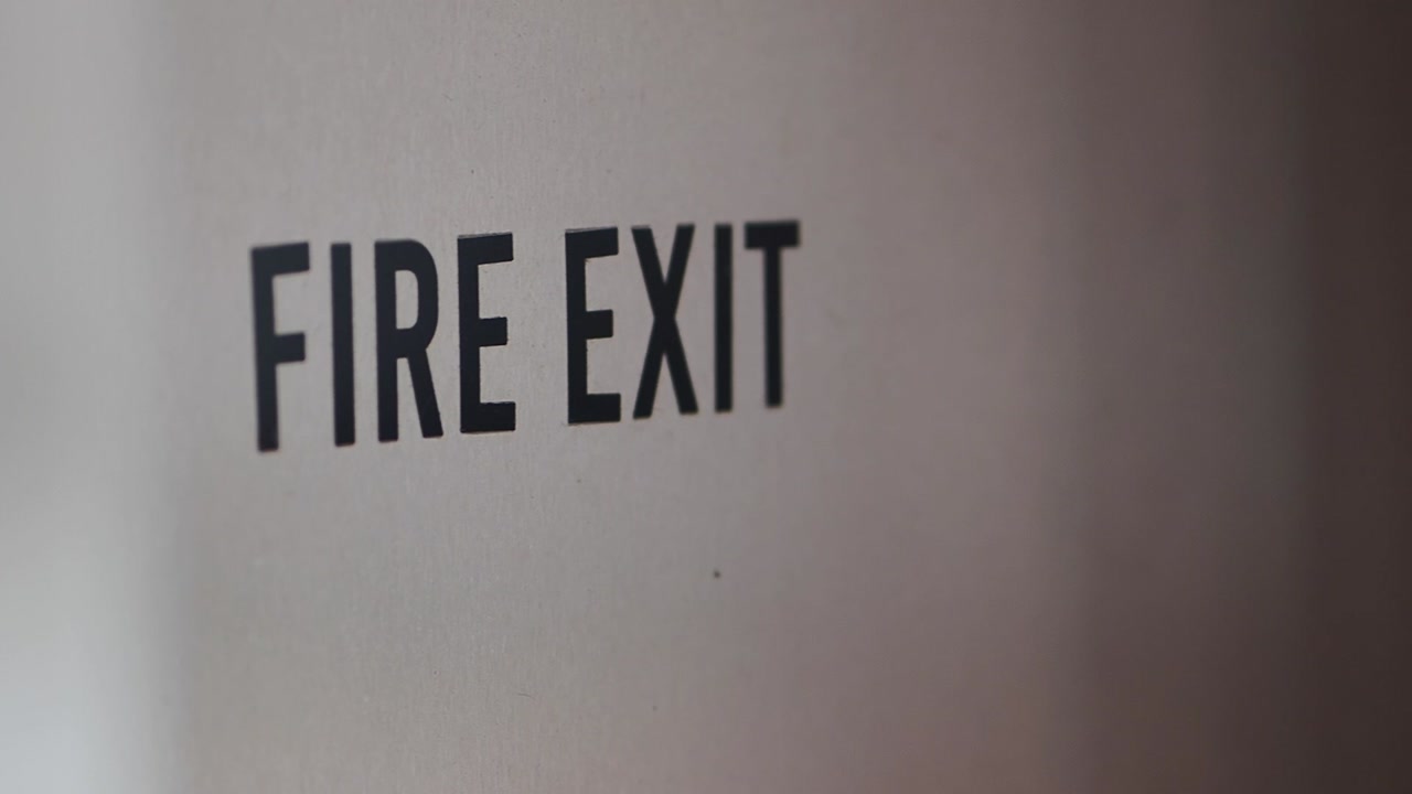 Close Up of Fire Exit Sign on a Door