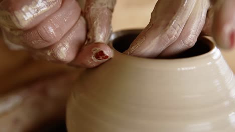 Skilled-Wet-Female-Hands-Of-Potter-Shaping-The-Clay-On-Potter-Wheel-And-Sculpting-Vase-Using-Fingers