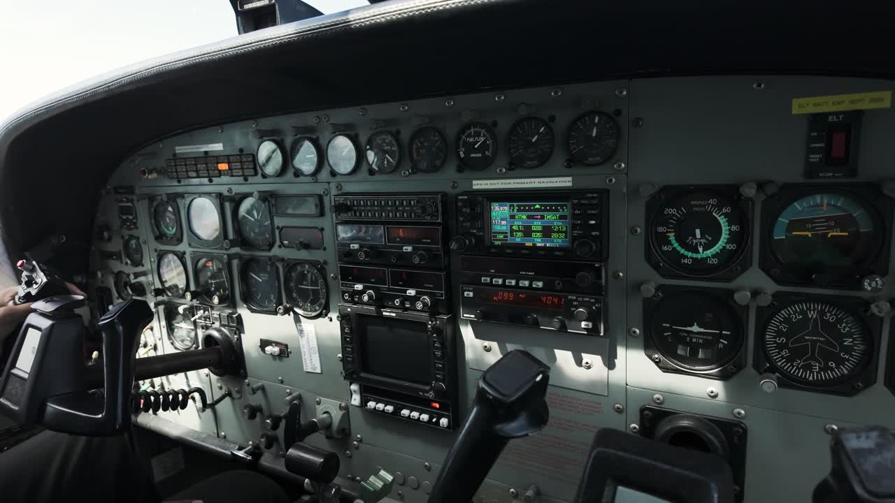 Instrument Panel And Yokes In Cockpit Of Cessna 208B Grand Caravan Aeroplane. panning shot