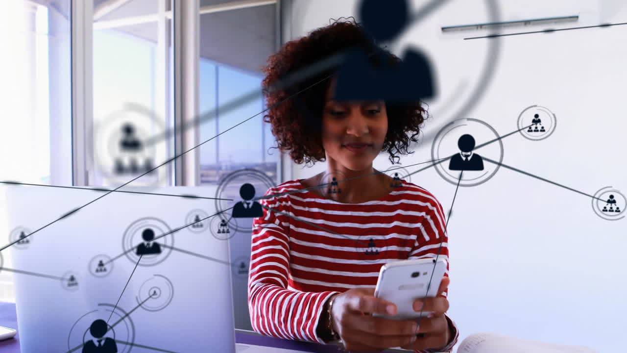 Animation of network of connections with people icons over african american businesswoman in office