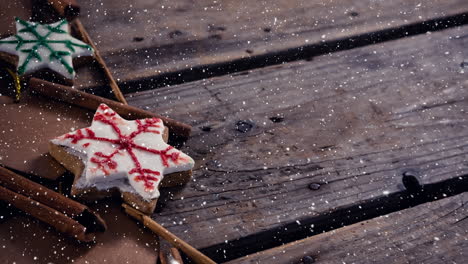 nieve cayendo con decoraciones de navidad en madera