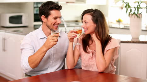 happy couple drinking white wine together