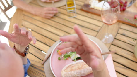 senior people dine at an outdoor table