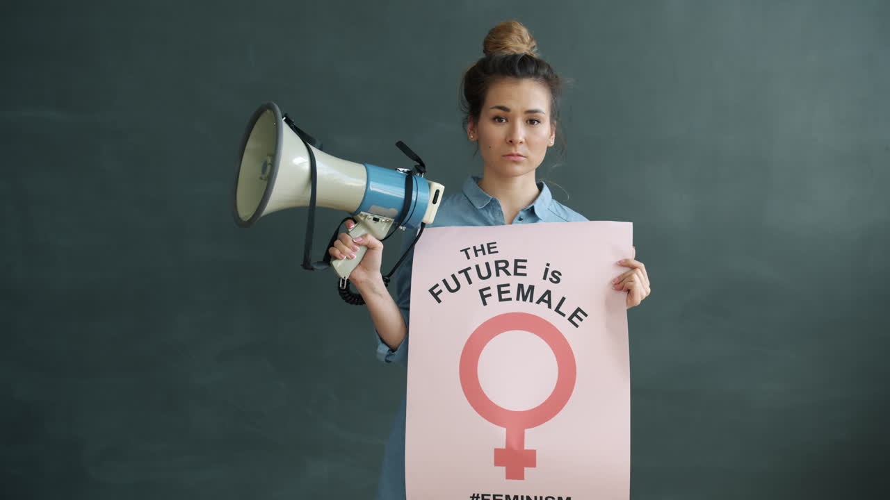 A Woman Holding a Megaphone and Poster with the Message 'The Future is Female'