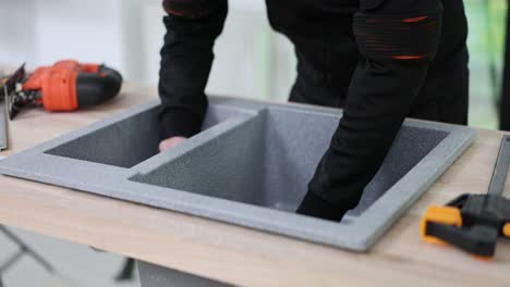 installing a granite composite sink in a kitchen countertop