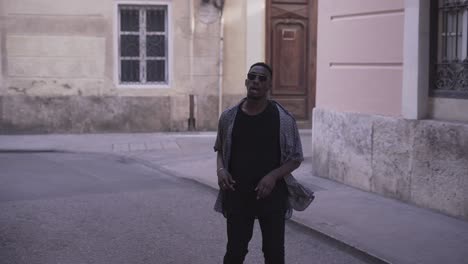 man walking in city street