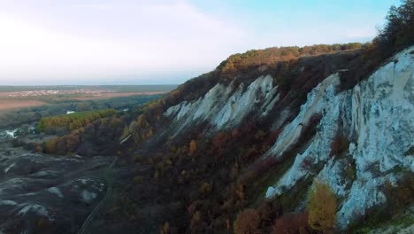 autumnal cliffs overlooking a valley and river