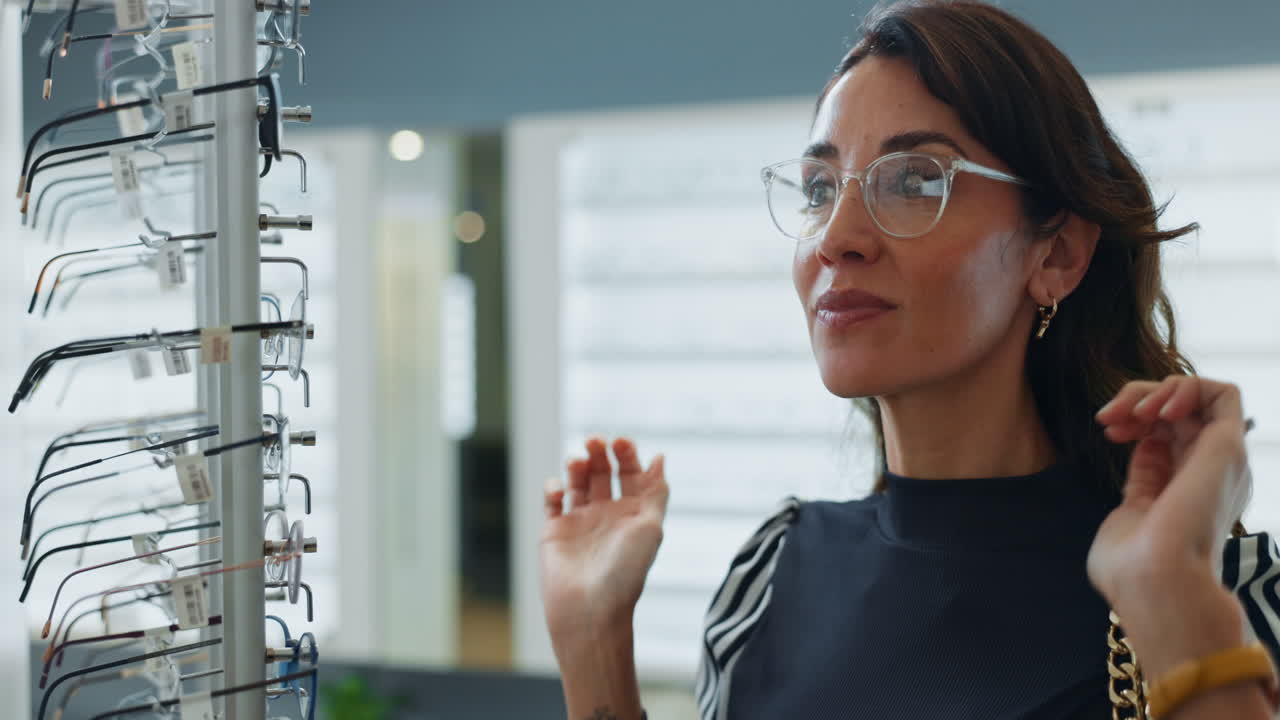 Woman Trying On Glasses At An Opticians