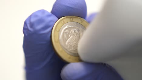 isolated close-up of the backside of one euro coin cleaned, laundering