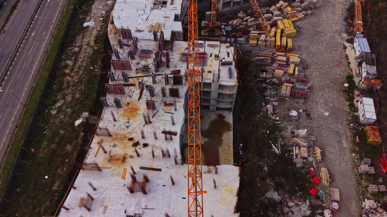 Construction site with crane overlook in urban area during daytime