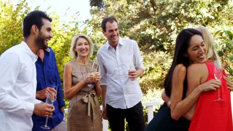 friends having fun while having glasses of champagne