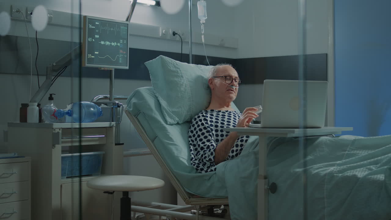 Patient in hospital ward talking on videocall with family