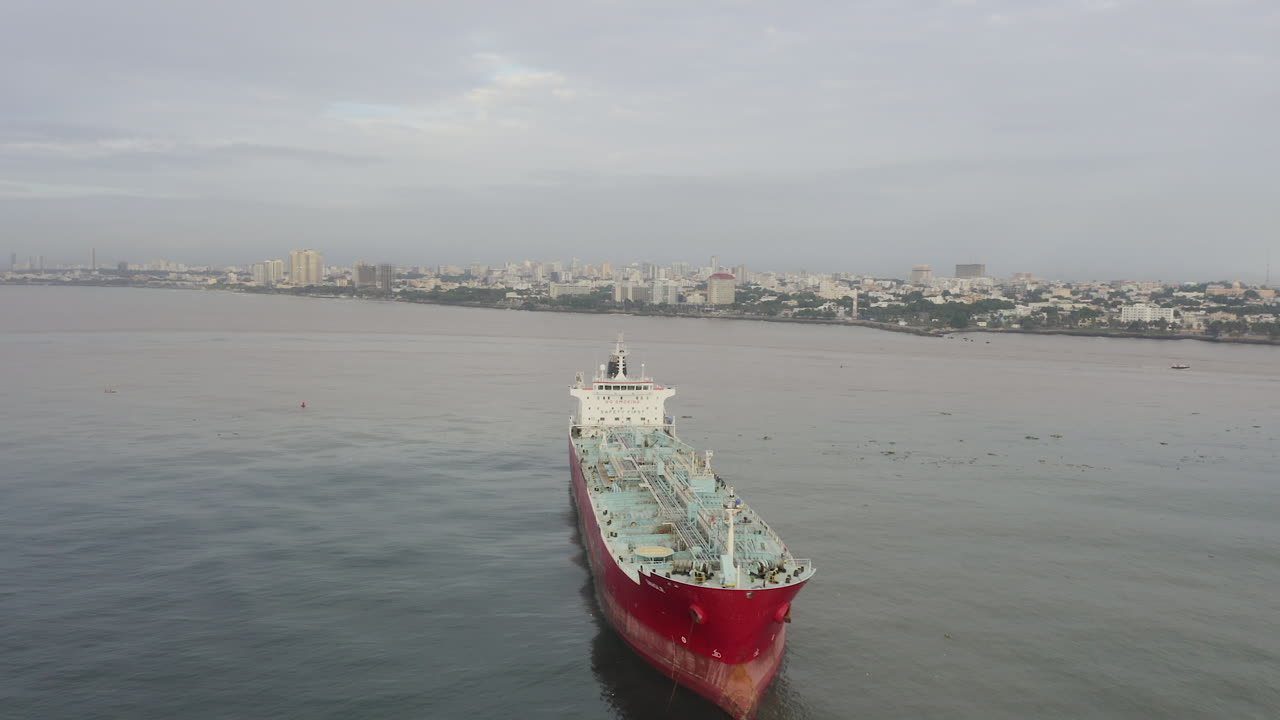 Ship moored off Santo Domingo coast in Dominican Republic. Aerial circling