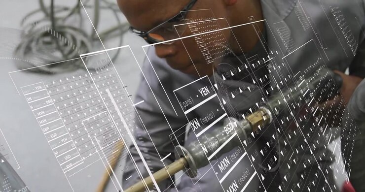 Tech kneeling using red clamp aligning brass torch, guiding seam while HUD overlay aiding metalwork