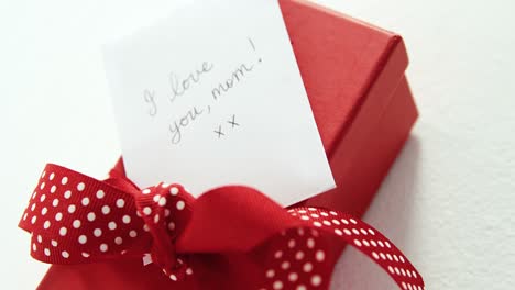 gift box with i love u mom text on white background