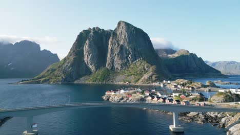 a sunlit day showcases an aerial perspective of a bridge gracefully linking the two sides of the lofoten islands in hamnoy, norway