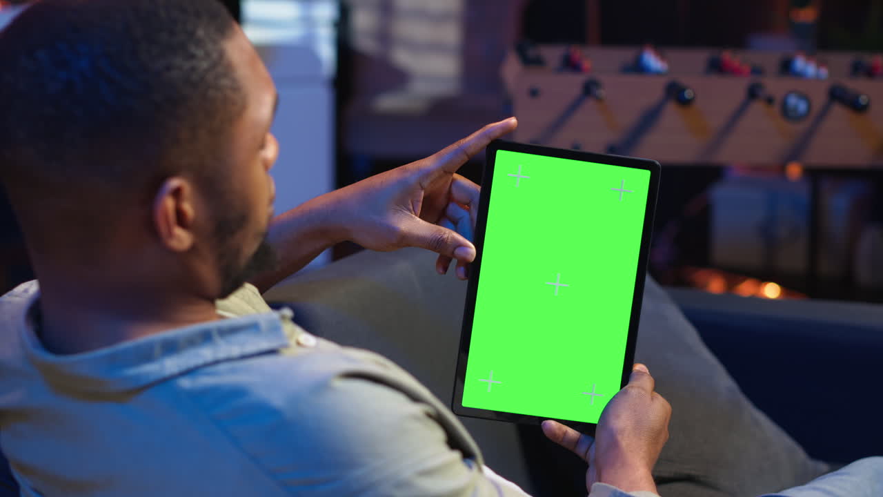 Vertical Video Relaxed male tech user holding device with isolated mockup screen