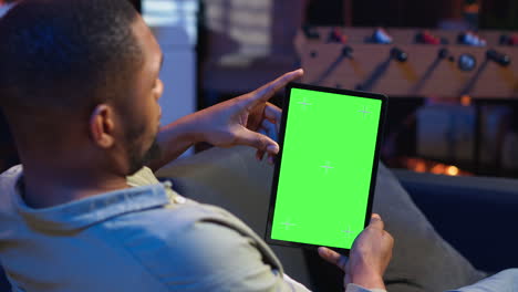 vertical video relaxed male tech user holding device with isolated mockup screen