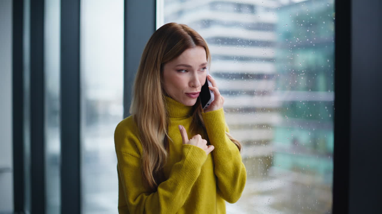 Annoyed manager talking mobile phone complaining on problem at office closeup