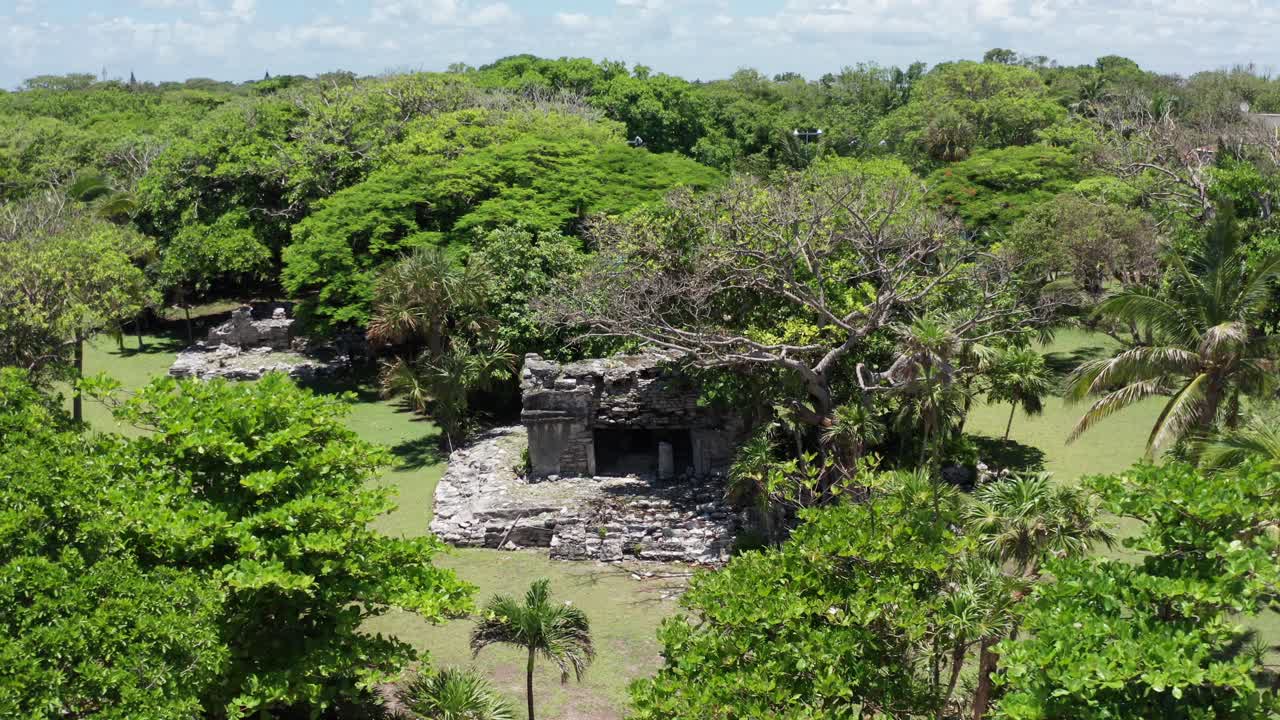 Low close-up aerial shot of the Xaman-Ha Mayan ruins in Playa del Carmen, Mexico. 4K