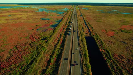 unique-orbiting-aerial-of-many-semi-trucks-drivers-on-highway-I-75,-Gainesville,-FL-32608