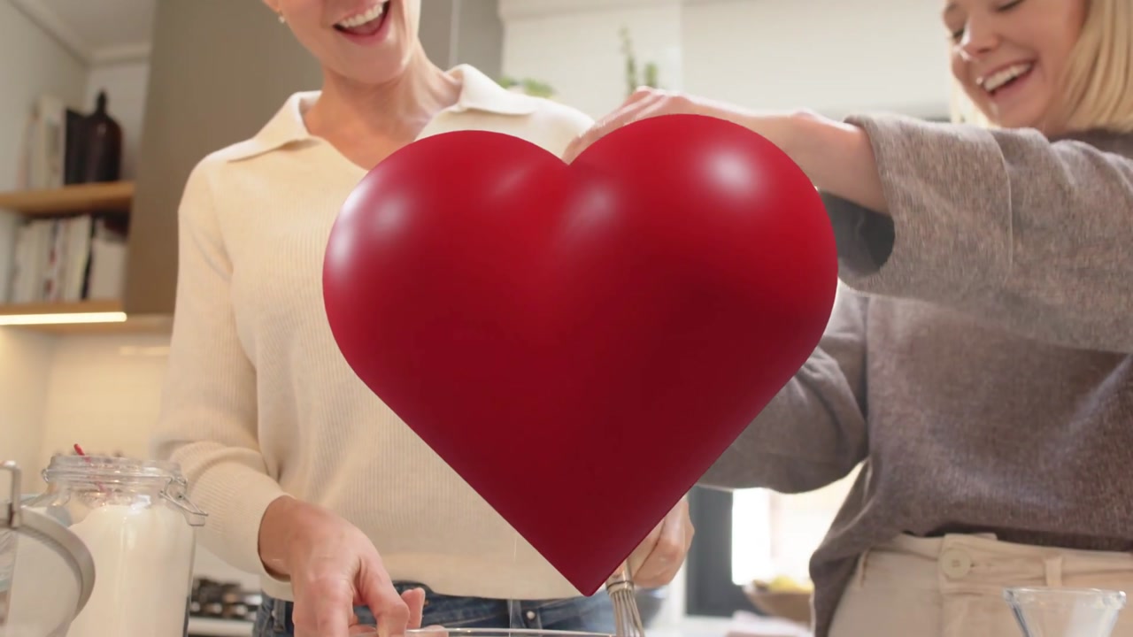 Mother and daughter cracking egg, starting whisking batter in kitchen while red heart pulsing