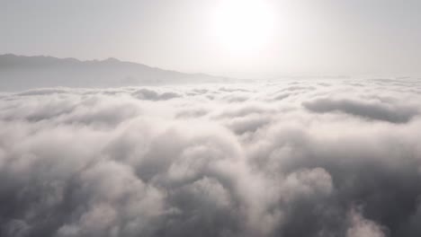 dramatic clouds over xianggong mountain in china, aerial view above clouds