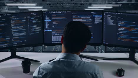 programmer working late in a data center