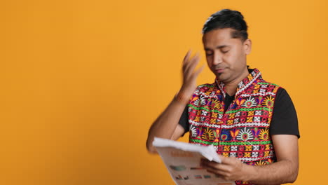 mad man throwing business documents in frustration, studio background