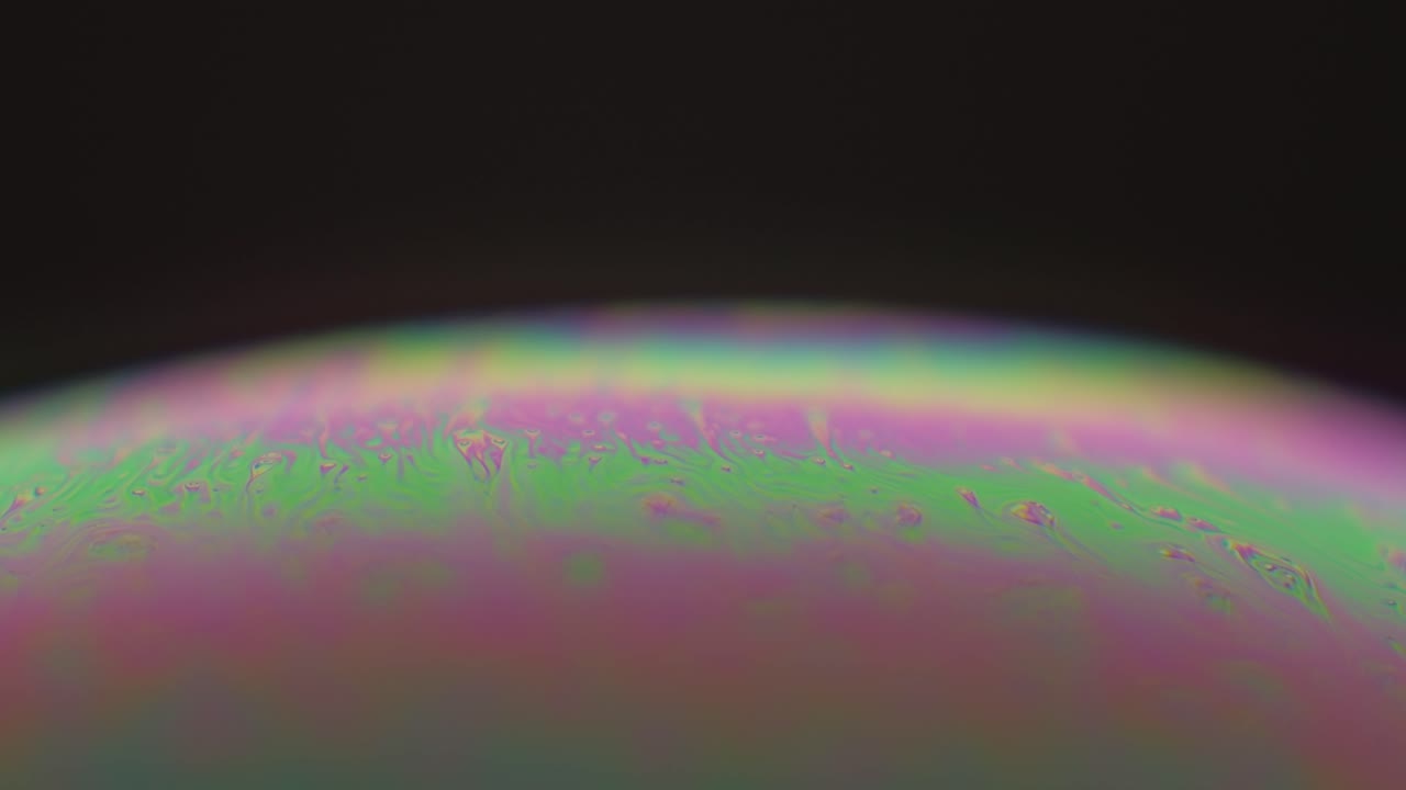 구형 표면의 추상 여러 가지 빛깔의 액체 배경