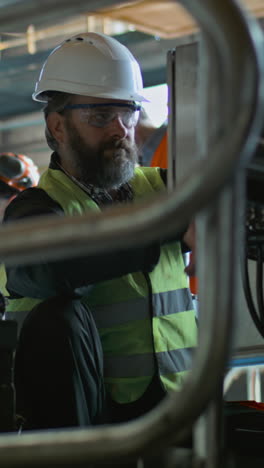 industrial worker performing maintenance on machinery