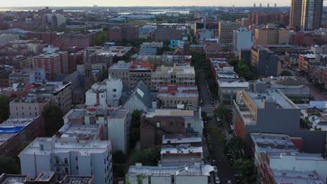 Aerial-flyover-the-Harlem-neighborhood-of-NYC-at-golden-hour-sunrise