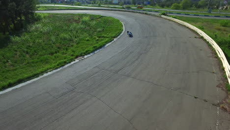 motorcyclists ride on racing track. aerial view moto race on racing track