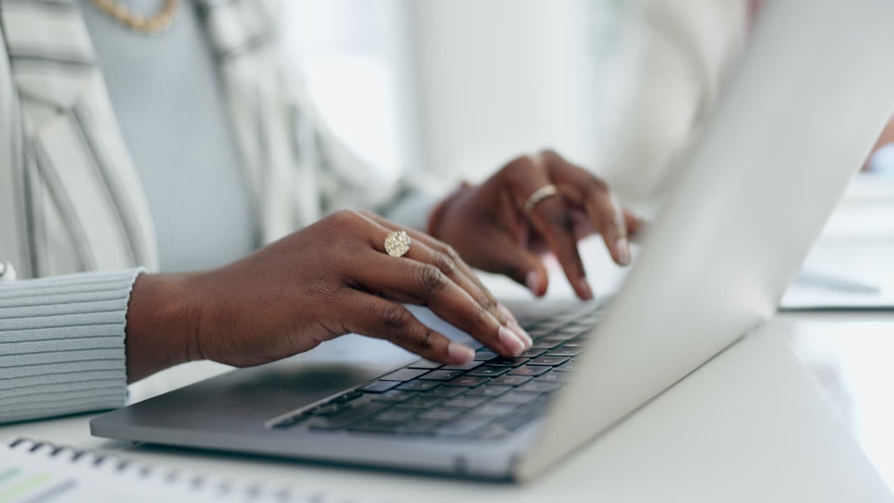Woman, typing and hands on laptop in office
