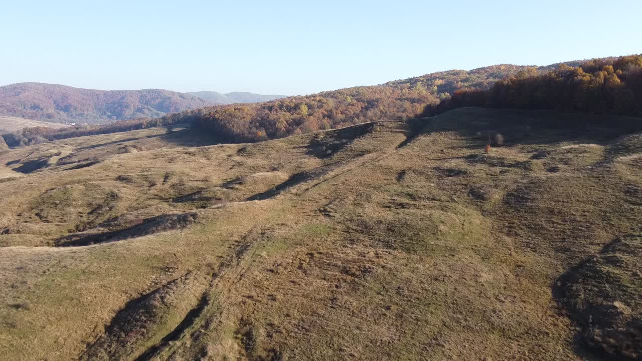 Aerial view of country hills at sunset in autumn season