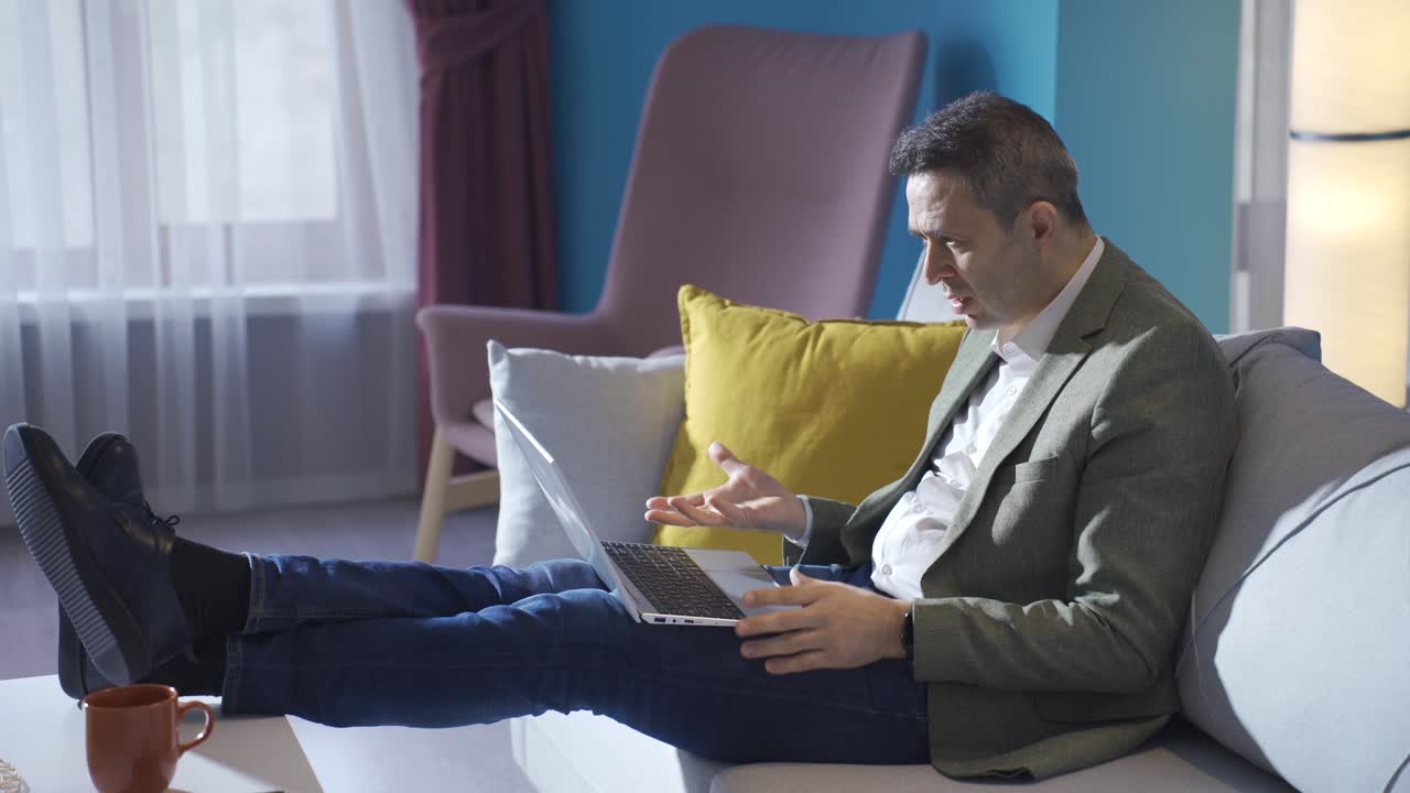 Mature man looking at laptop with amazement. Amazed man.