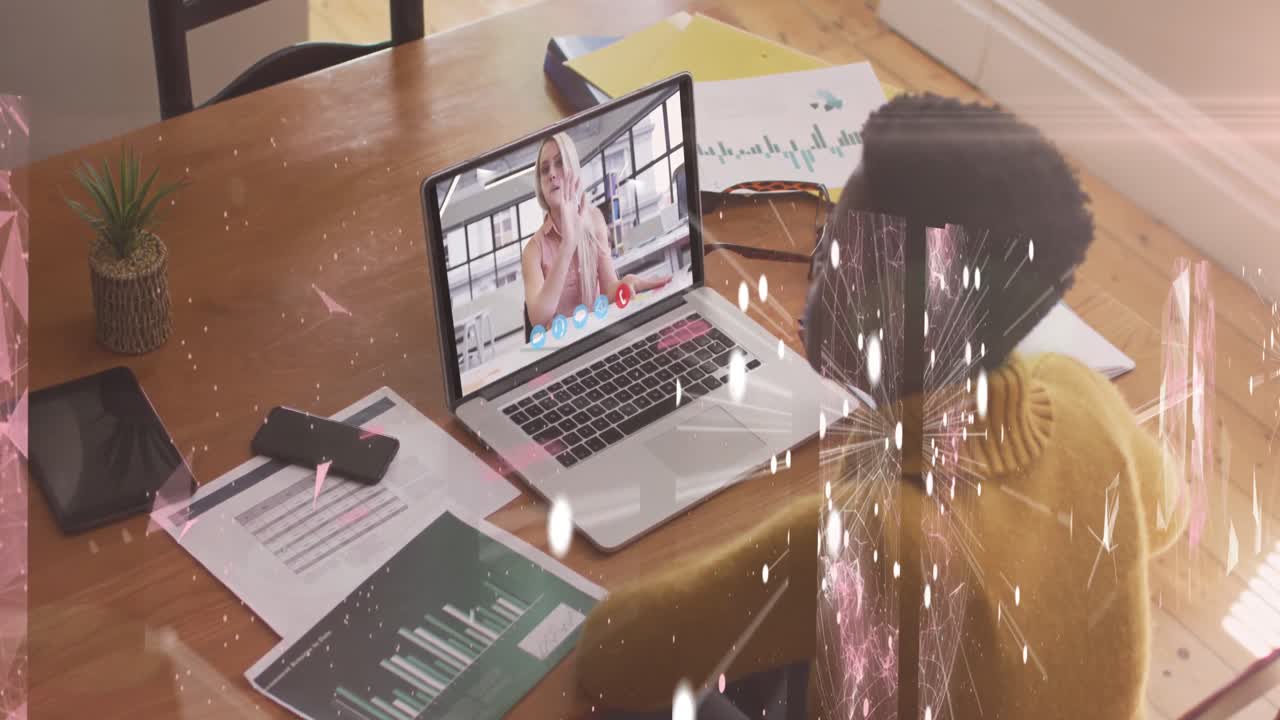 Animation of connections and shapes over african american woman having video call on laptop