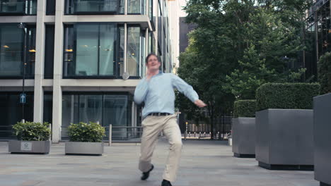 contemporary funky caucasian businessman street dancer dancing freestyle in the city